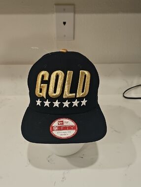 New Era Black Snapback Hat with Gold 'GOLD' Embroidery